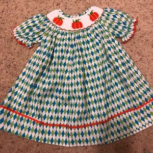 Green/blue smocked dress w/Pumpkins